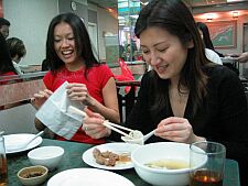 delicately eating the xiao long bao