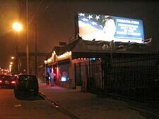 late night club Sno-Drift under a Nancy Pelosi billboard